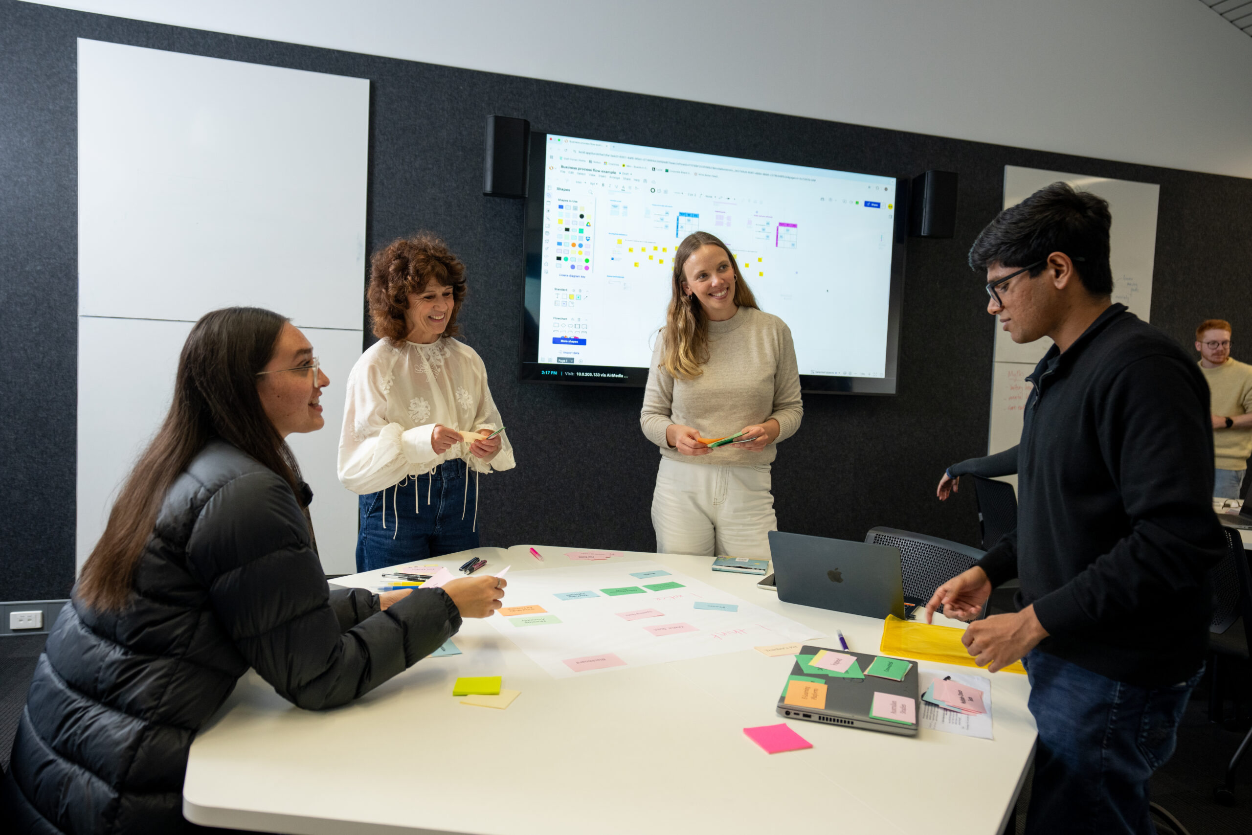 Academic working with students on an activity